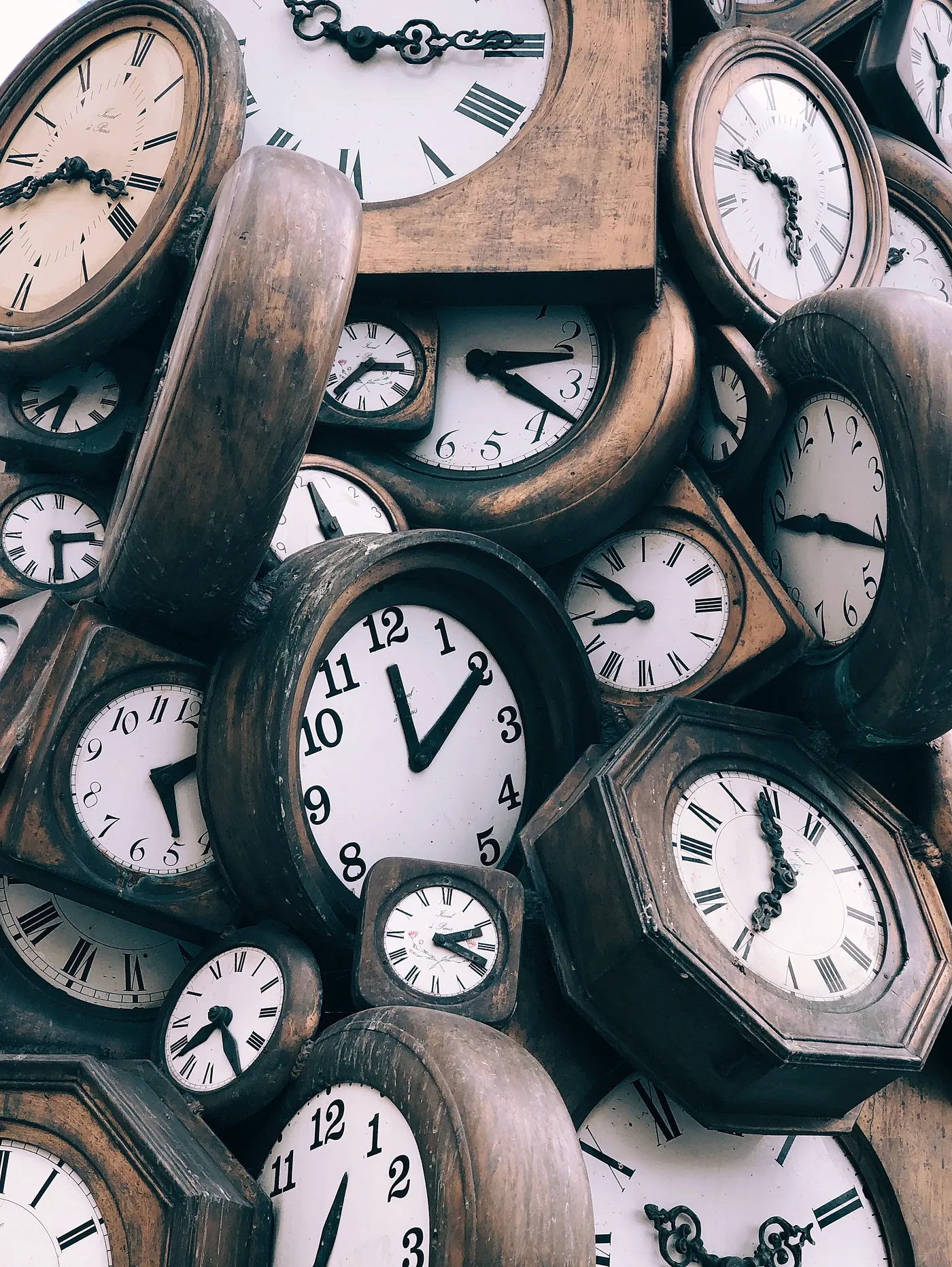 bunch of old wooden clocks